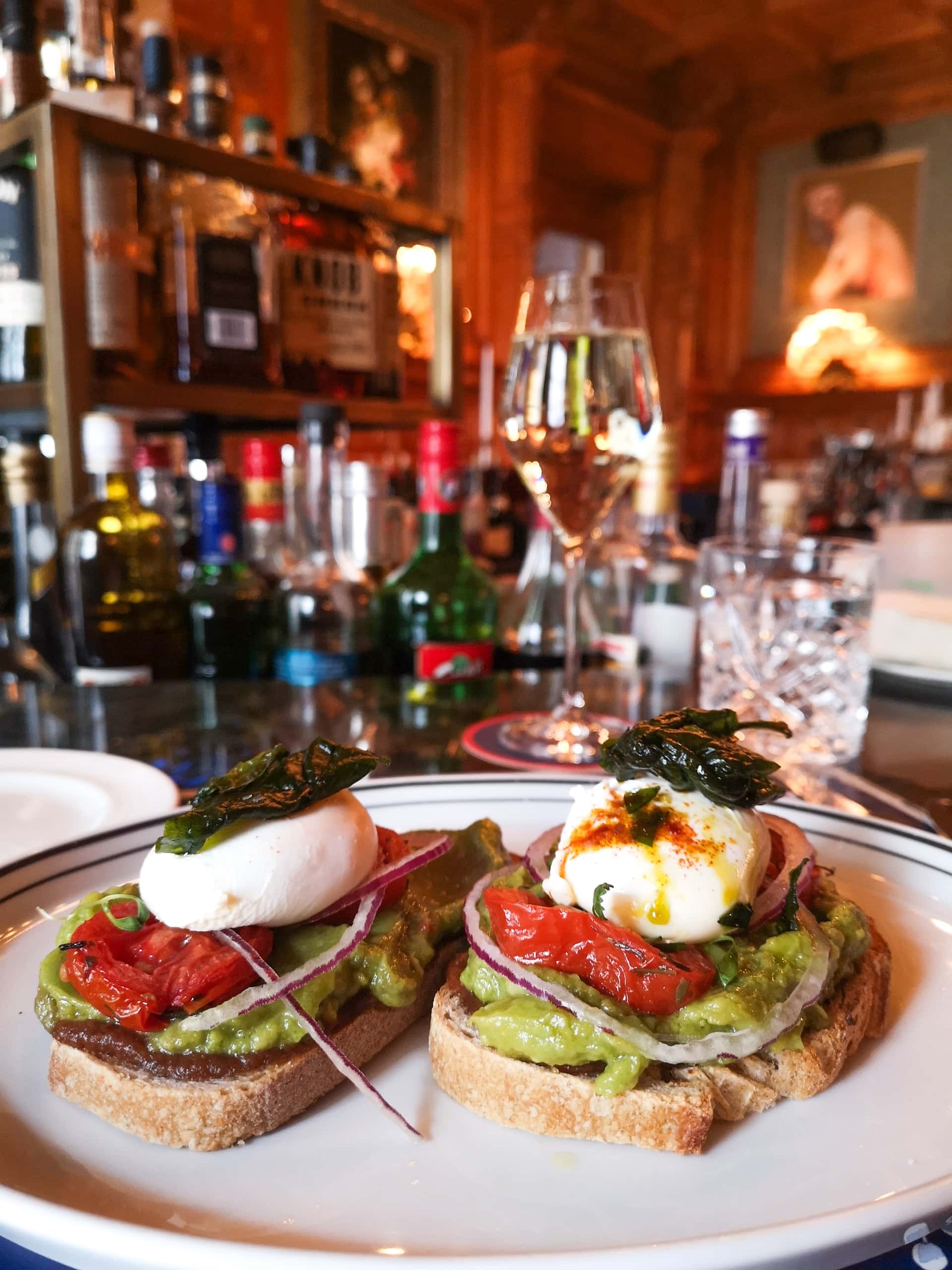 poached eggs on avocado toast at a classy breakfast restaurant in Covent Garden