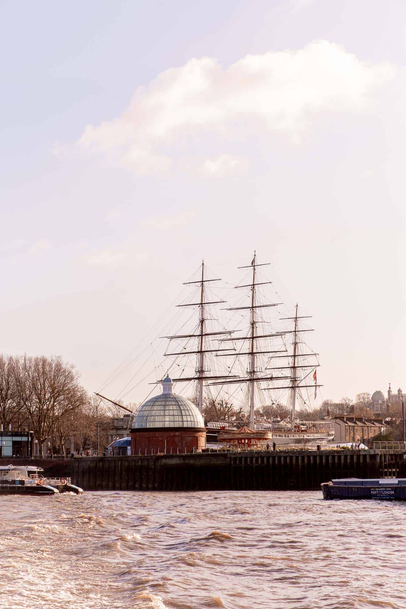 Replica Pirate ship on the river Thames, over the Greenwich Foot Tunnel