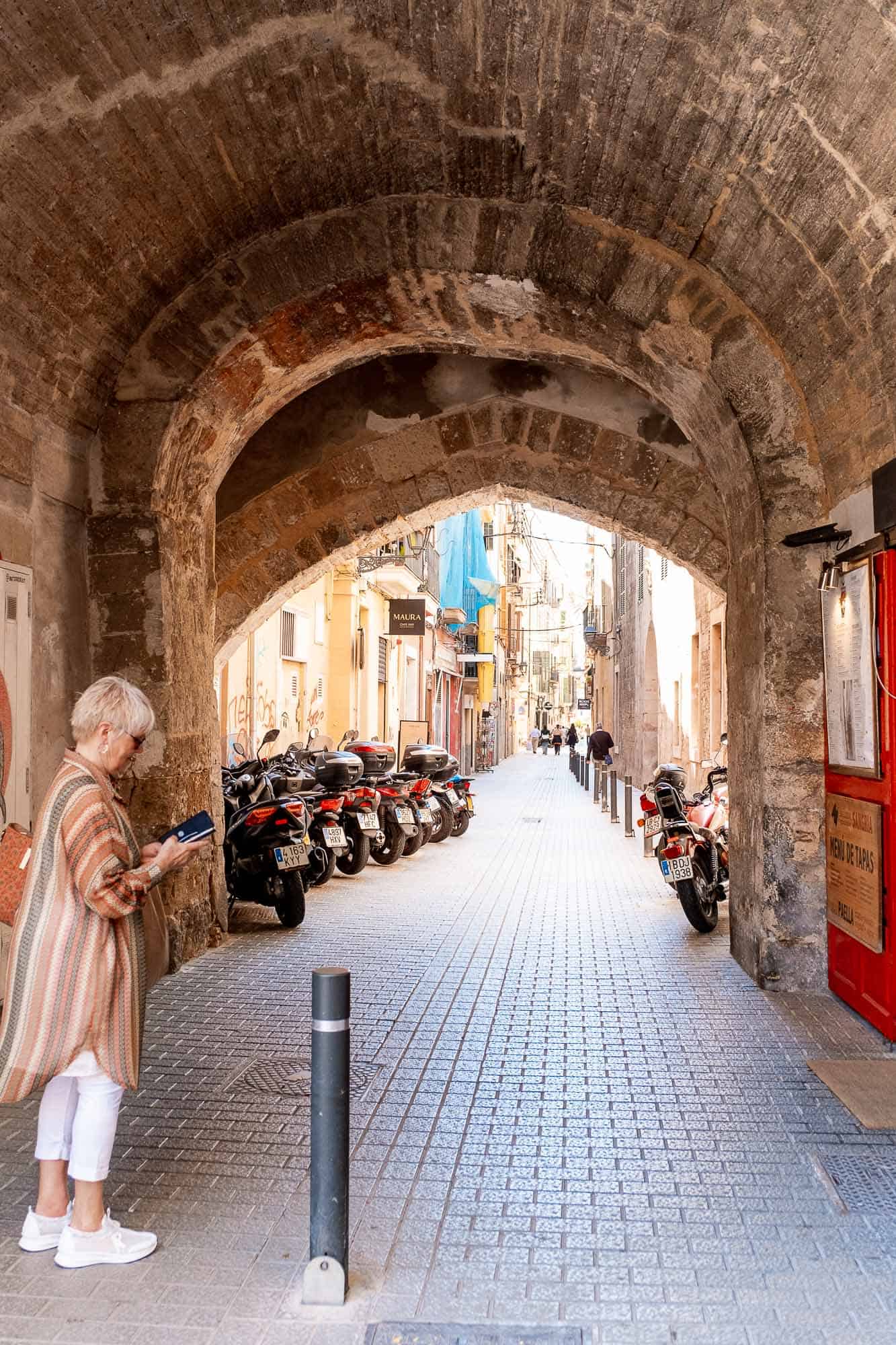 Palma Walking Tour woman walking in the streets of Palma