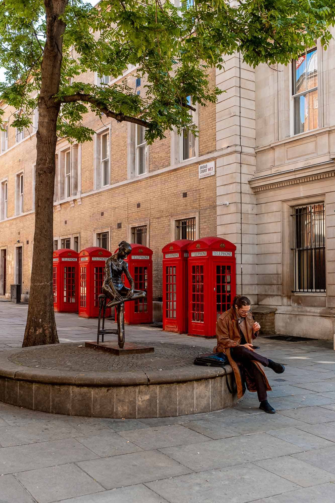 A quiet street in London with telephone booths – a quintessential part of London