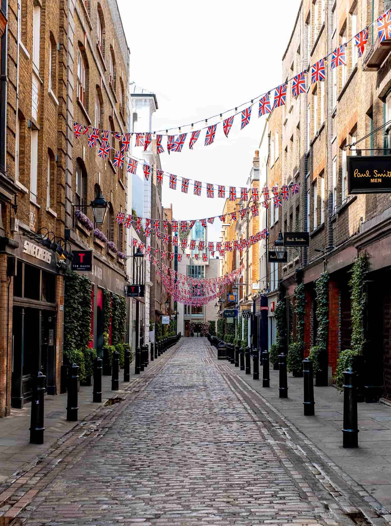 A street in London decorated with British flags hanging over the street