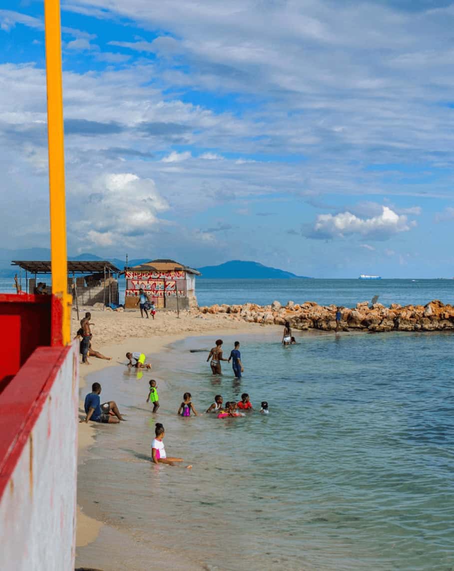 Hellshire Beach Jamaica Kids swimming in the sea at Hellshire Beach Jamaica in Kingston Jamaica