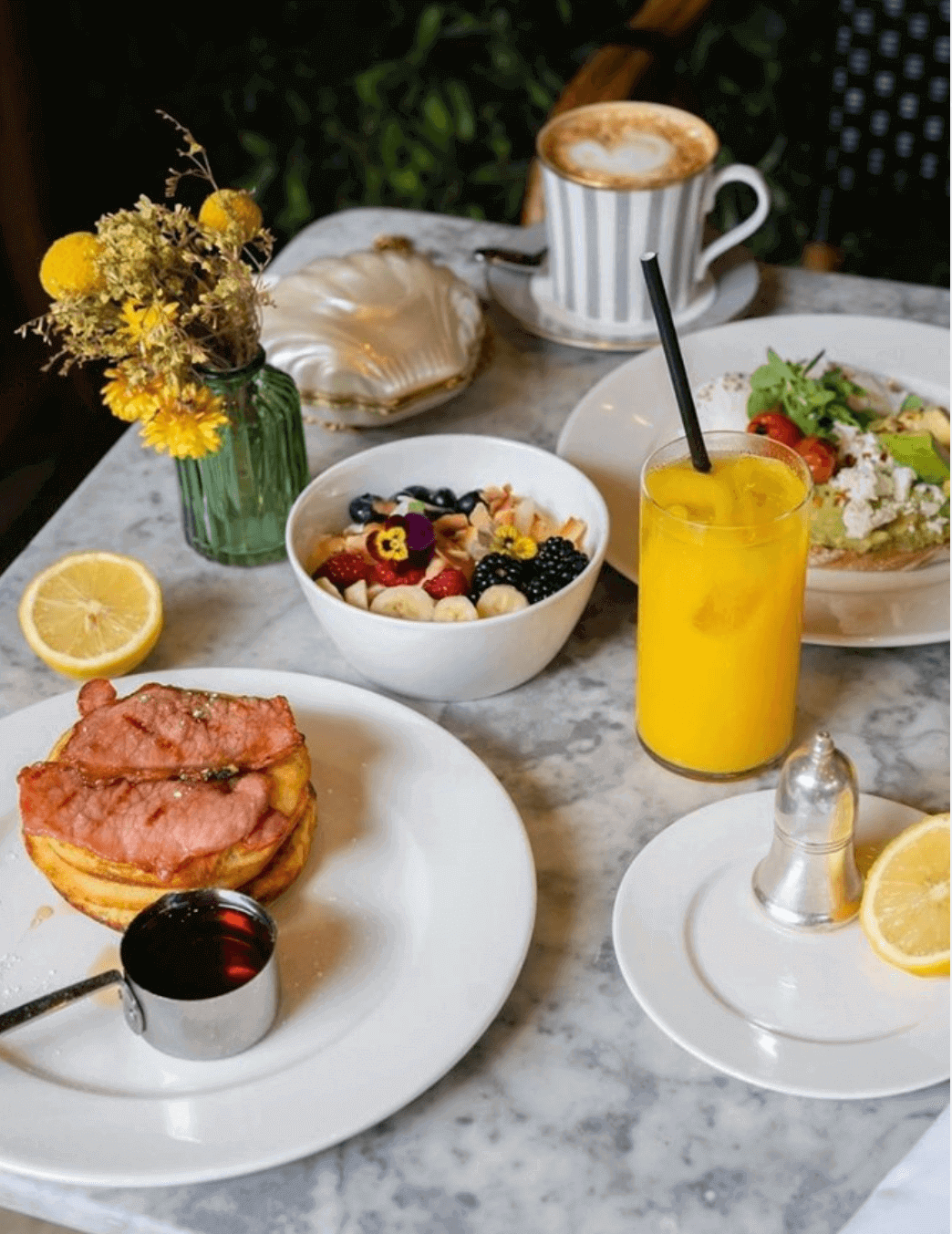 Dalloway Terrace London breakfast of fruit bowl and bacon and pancakes