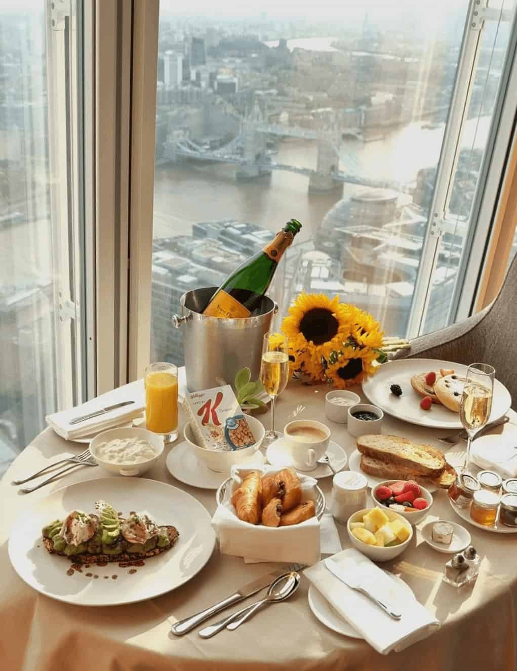 Shangri La London Breakfast with a view at Shangri-La at The Shard with a avocado and toast, fresh fruit and scones