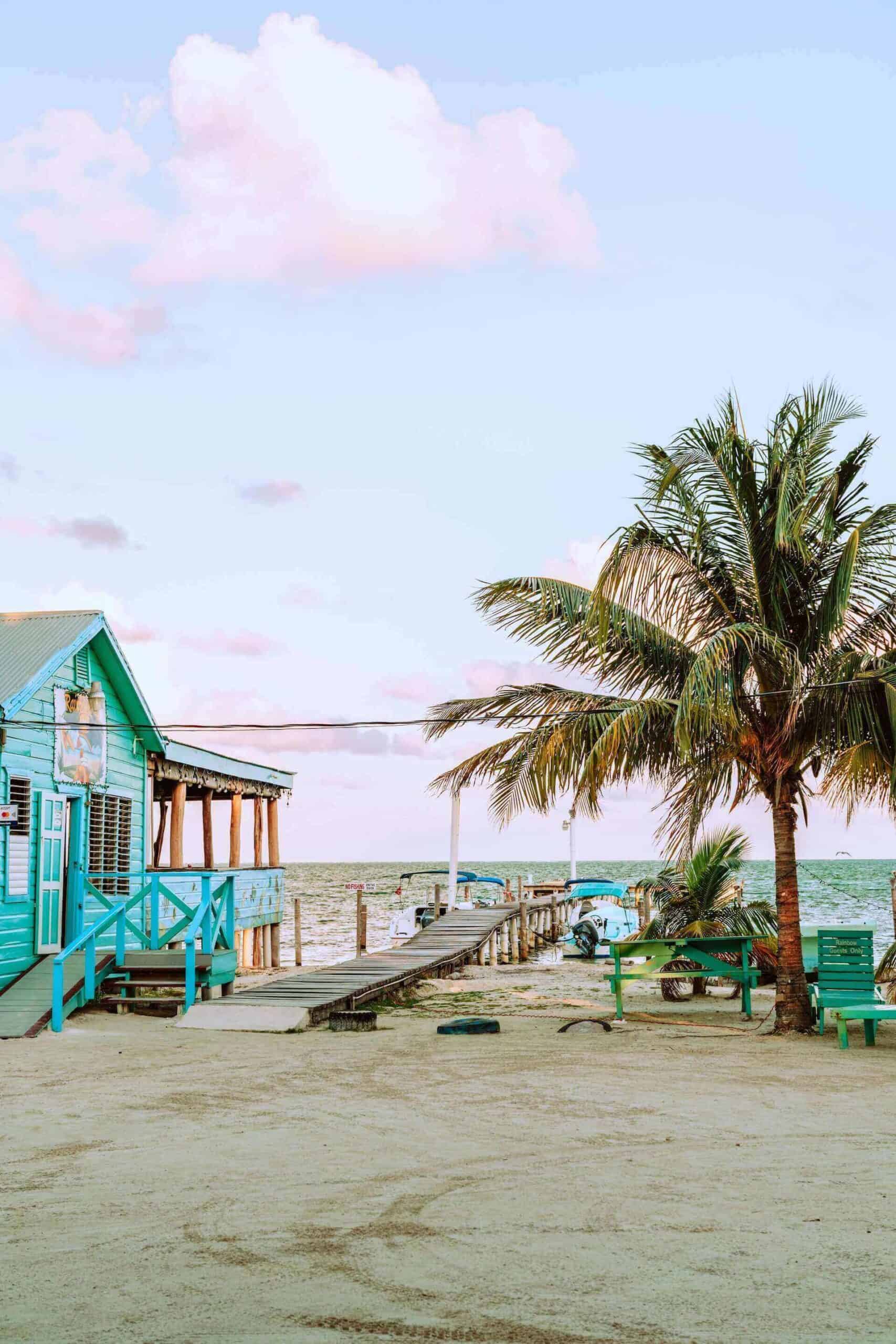 Belize scaled sandy beach and beach huts inBelize