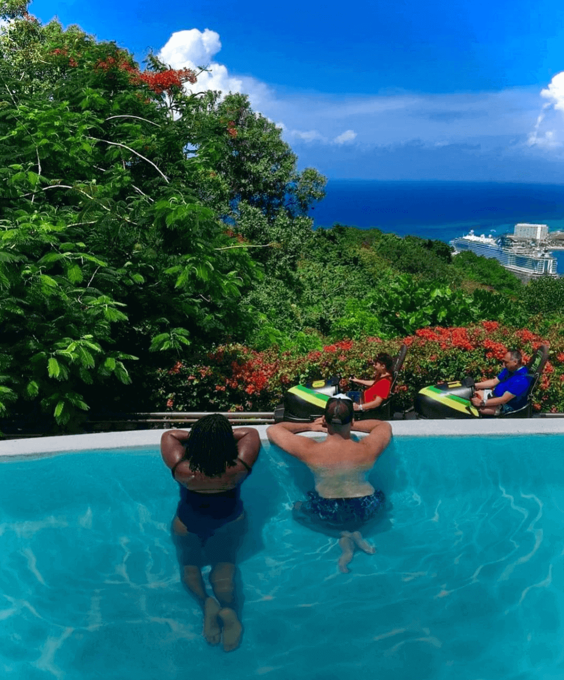 Mystic Mountain in Jamaica two people in the infinity pool at Mystic Mountain in Jamaica watching the bodsled and see views