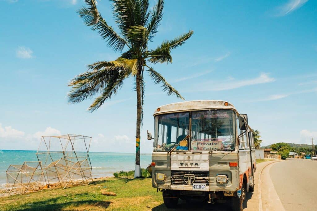 Worst Time To Go To Jamaica bus on the side of the beach in Jamaica, showing alternative days to visit Jamaica