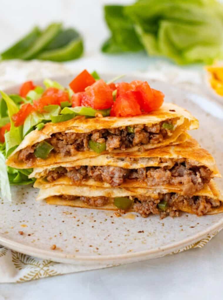cheesy pork sausage and bell pepper quesadilla with lettuce and tomato