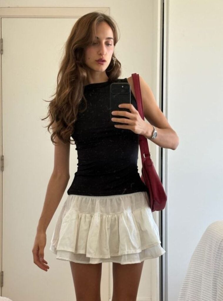 black tank + mini ruffle skirt + shoulder bag