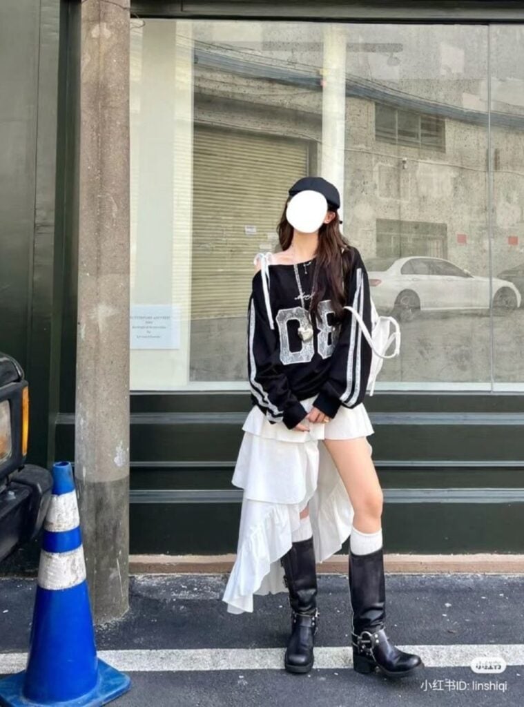 graphic knit + high-low ruffle skirt + tall boots