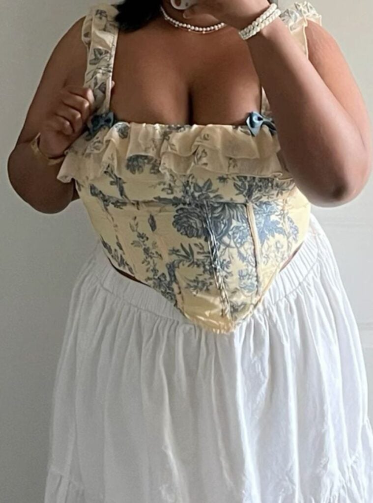 ruffled corset top + white tiered skirt + pearls