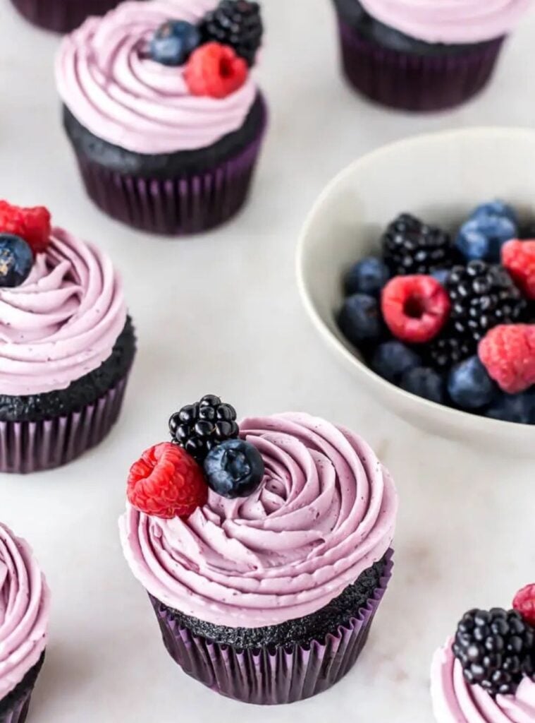 nutella stuffed chocolate cupcakes with triple berry buttercream