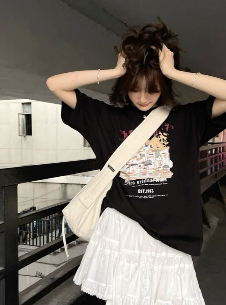 graphic tee + mini ruffle skirt + canvas bag