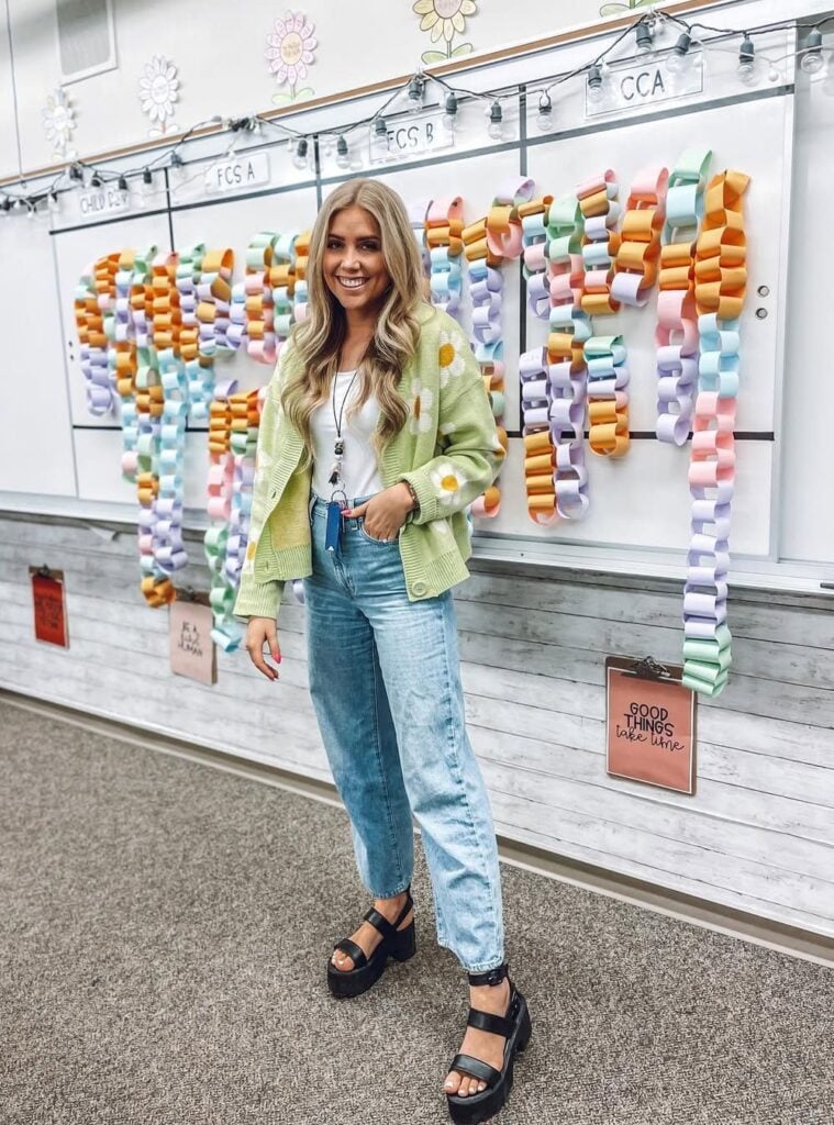 graphic cardigan + light-wash jeans + platform sandals