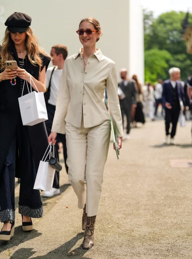 cream pantsuit + snakeskin boots + sunglasses