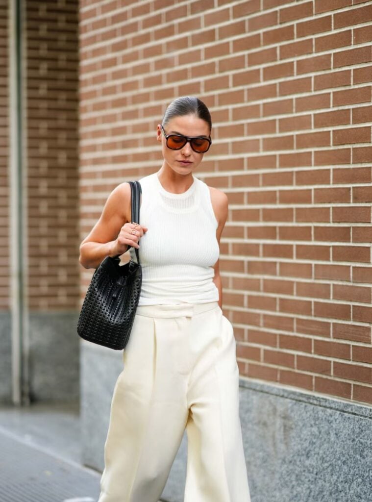 sleeveless knit top + cream trousers + oversized sunnies