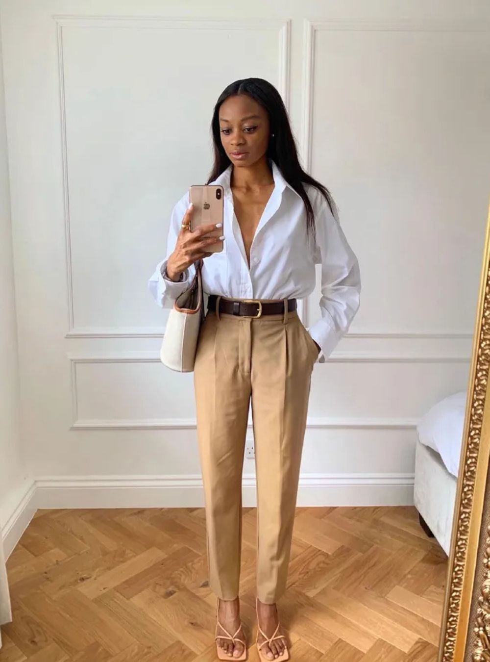 white button-down shirt + beige trousers + brown belt + nude heels + white shoulder bag