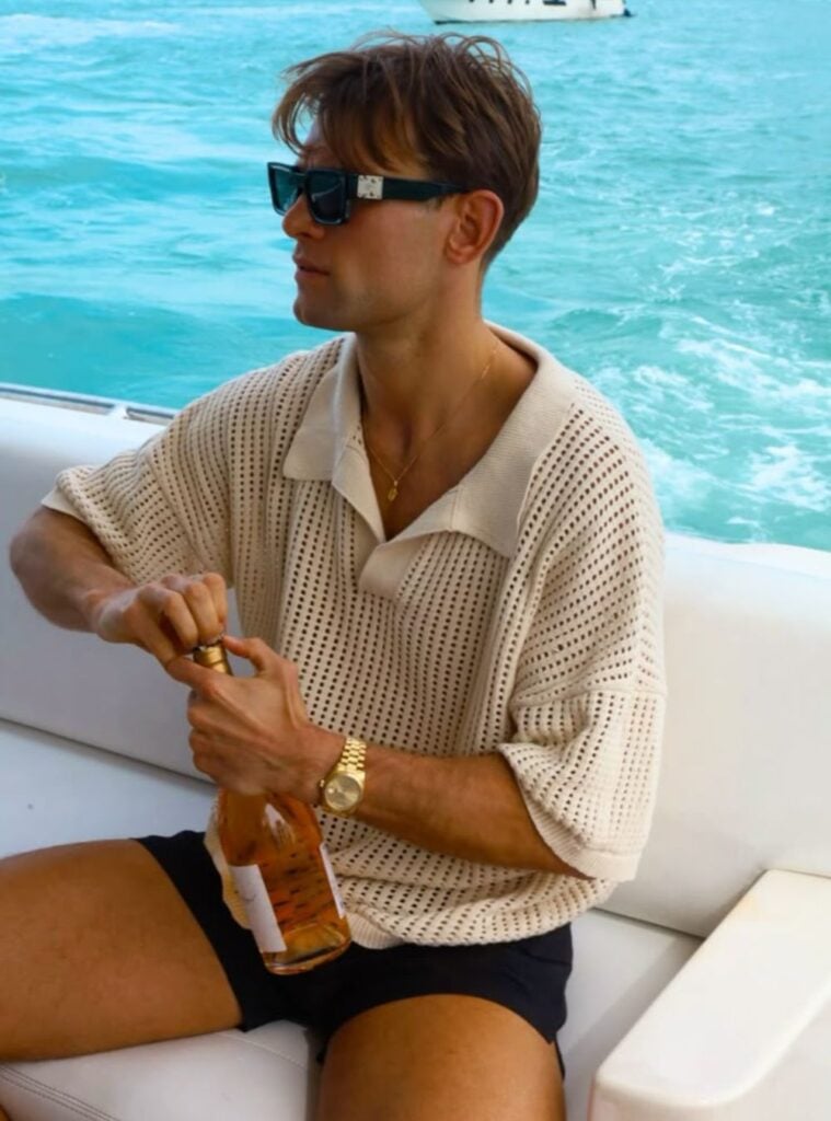 mesh polo shirt + black swim shorts + gold watch