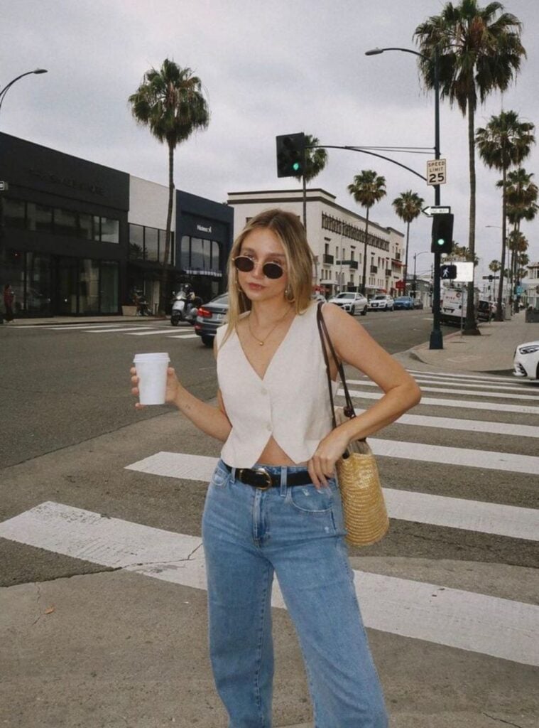cropped vest + straight-leg jeans + straw bag