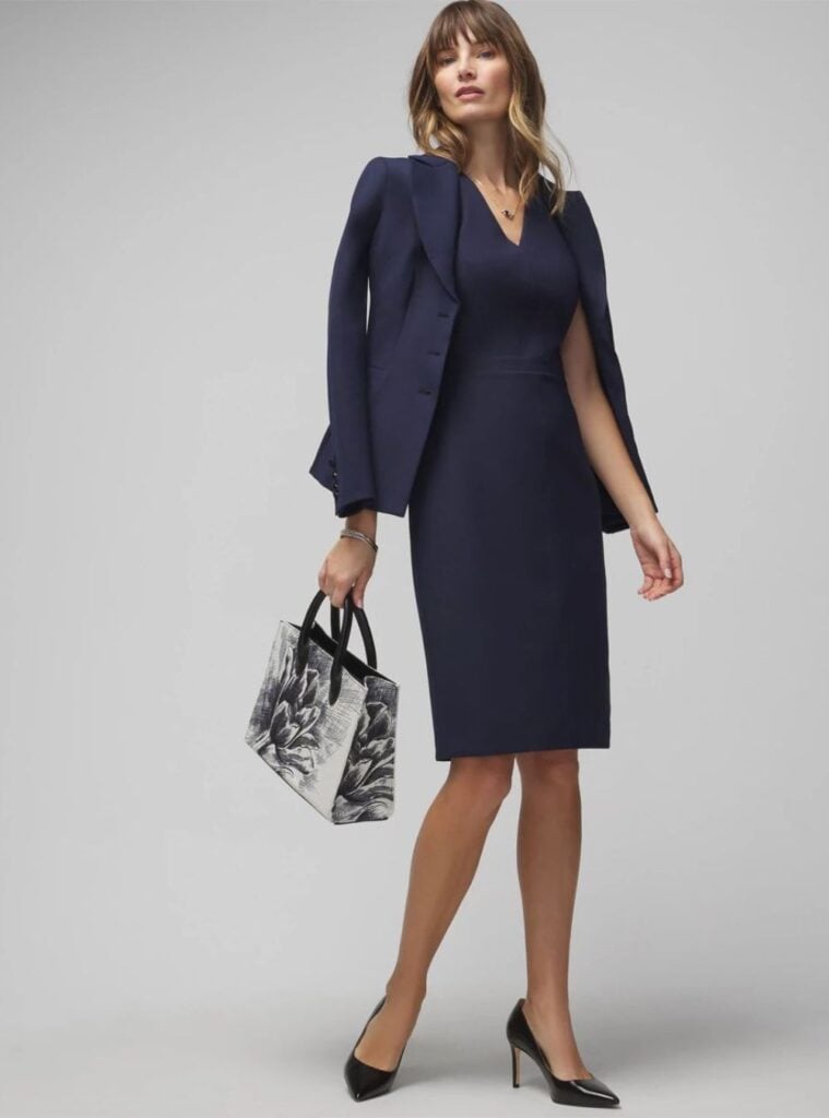 navy blazer + navy sheath dress + black heels + black and white printed handbag