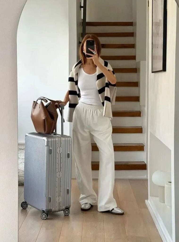 striped sweater + tank top + travel trousers