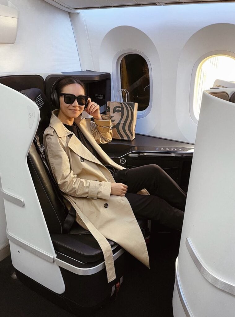 trench coat + black pants + headphones