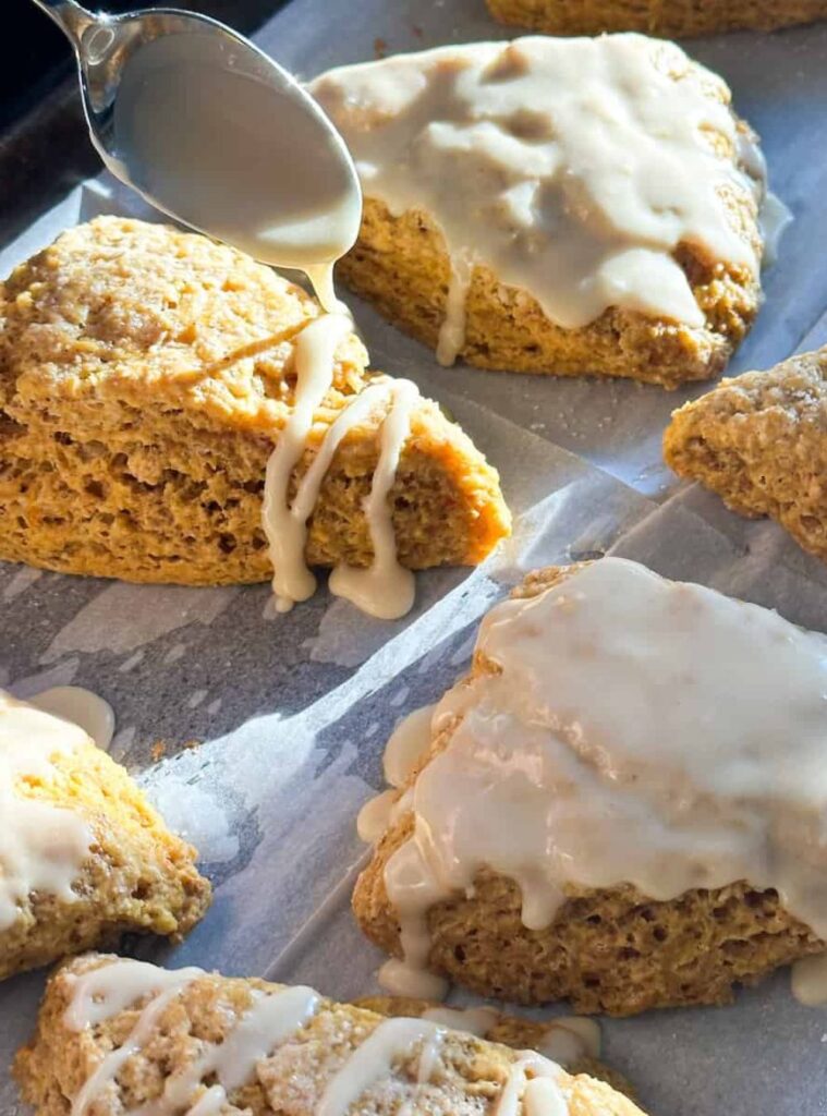 triangular pumpkin scones with light icing, wholesome and perfect for healthy pumpkin recipes