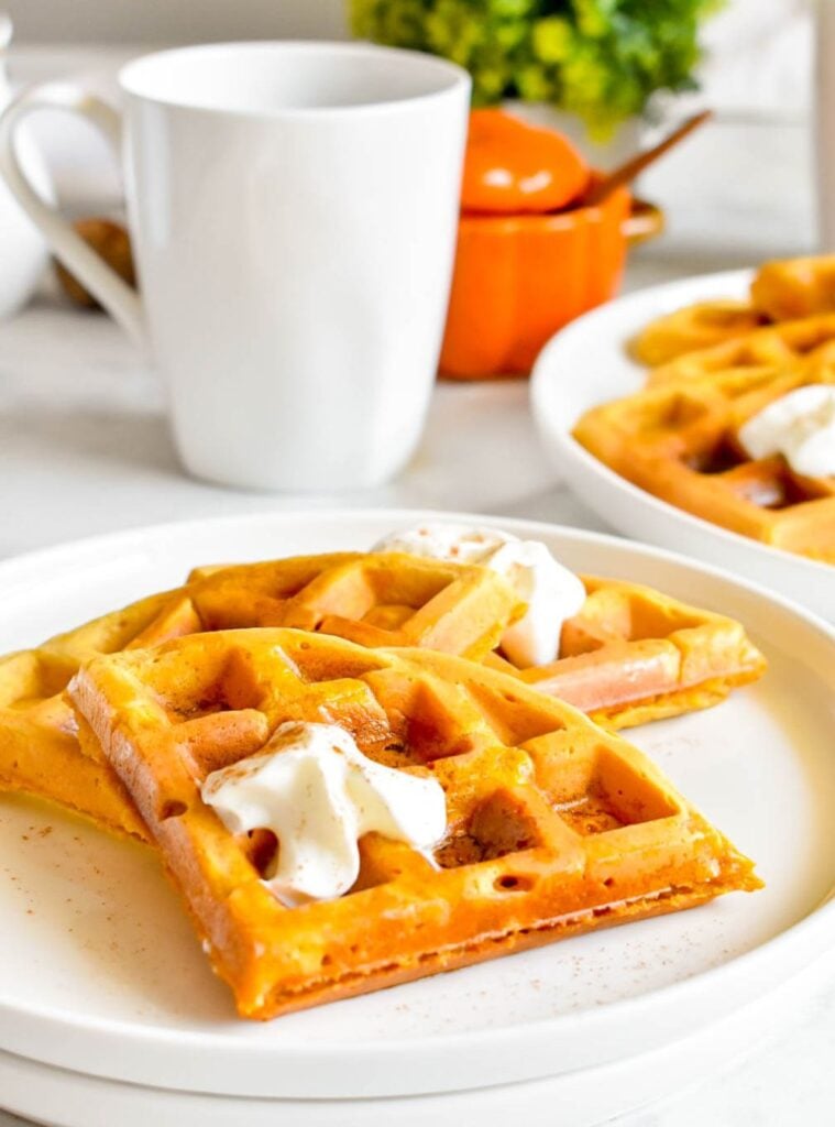 stack of pumpkin spice waffles with syrup and butter, weekend fall cooking favorite