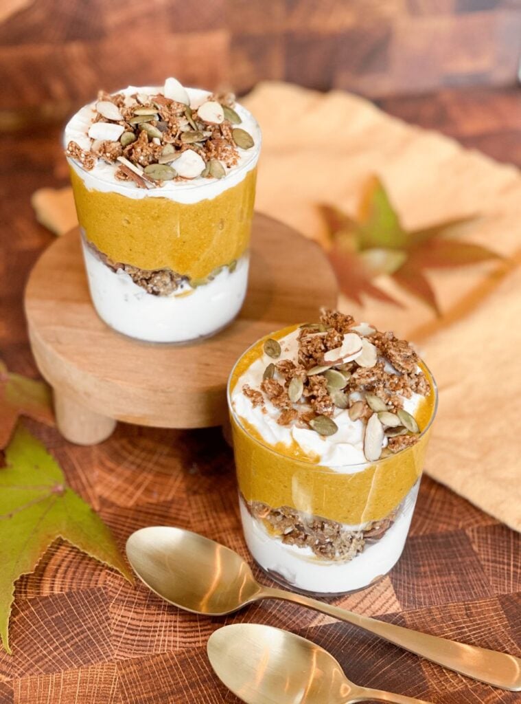 layered parfait with pumpkin, yogurt, and granola in a glass, fresh healthy pumpkin recipes choice