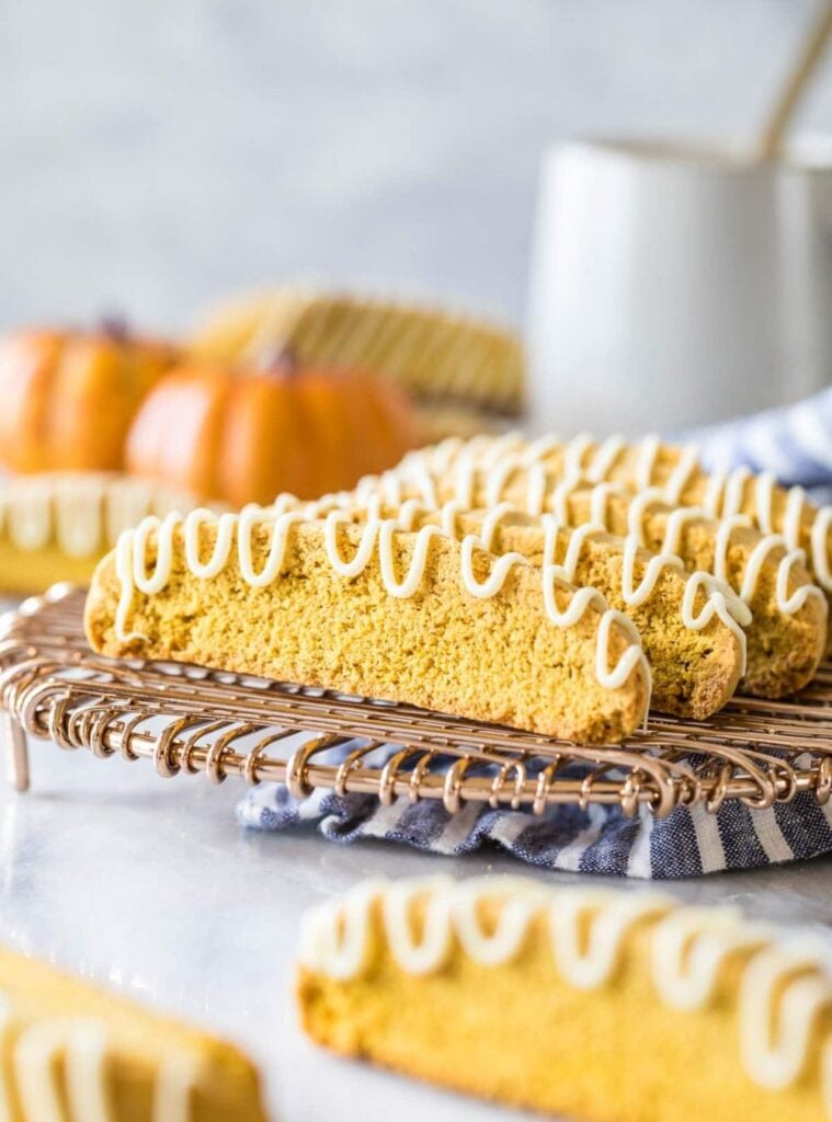 pumpkin biscotti slices arranged with a cup of coffee
