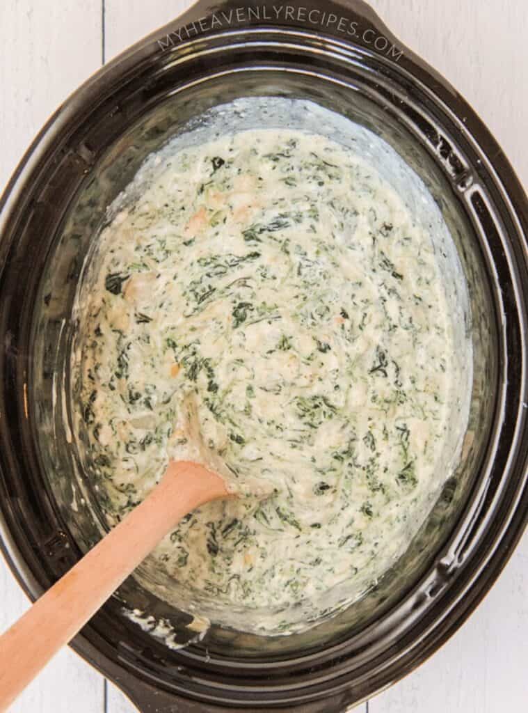 Creamy crockpot spinach artichoke dip served warm, great for parties and game nights.