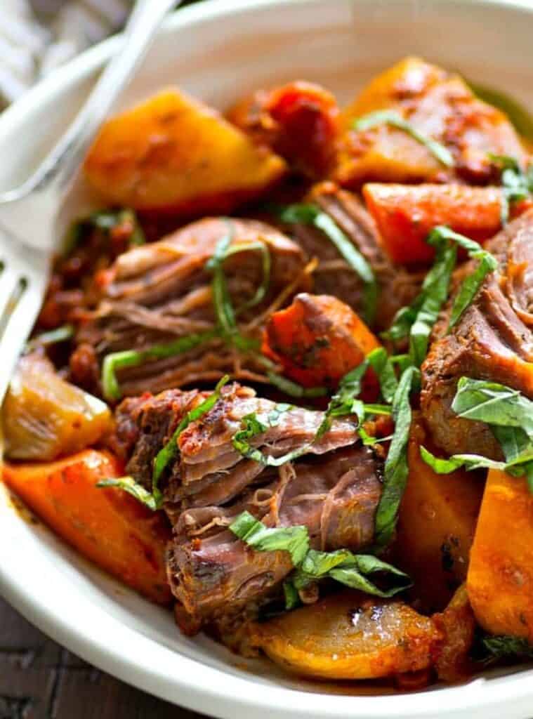 pot roast with carrots and potatoes in a slow cooker, classic fall crockpot dinner recipe