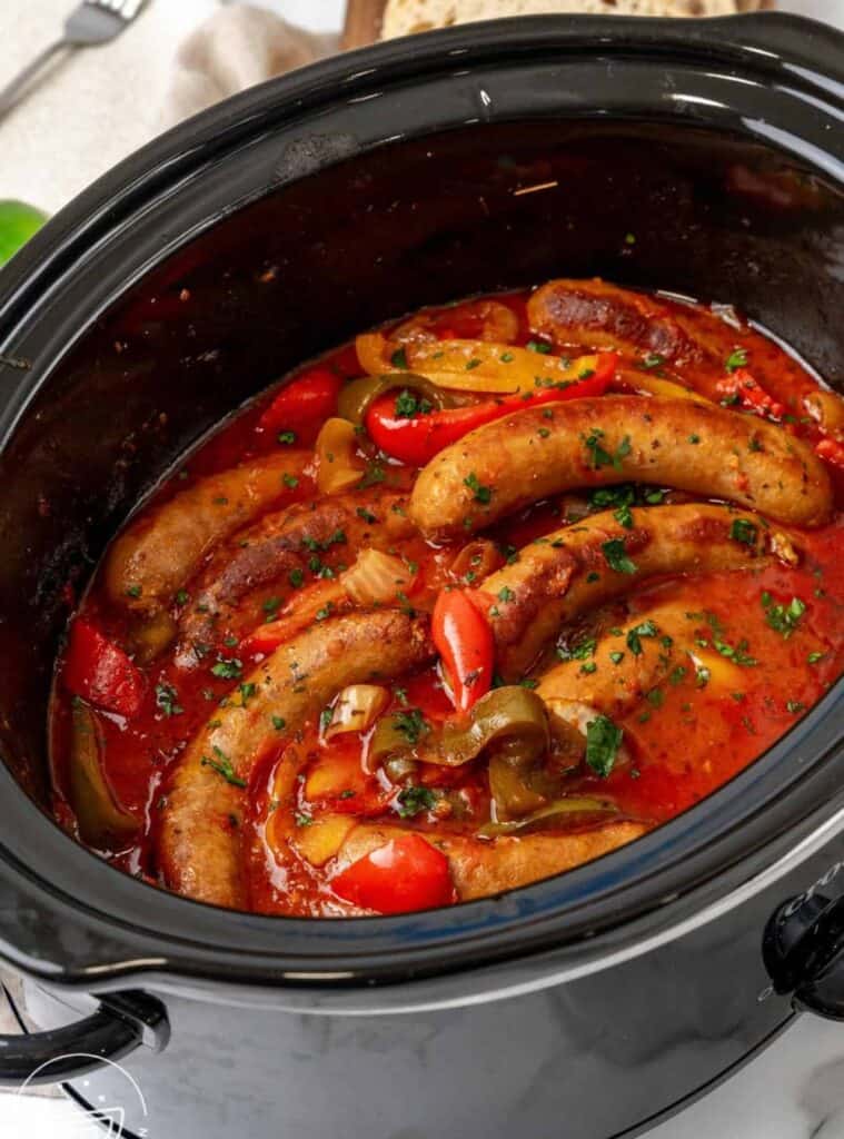 sausage and peppers cooked in crockpot, quick and easy fall dinner recipe