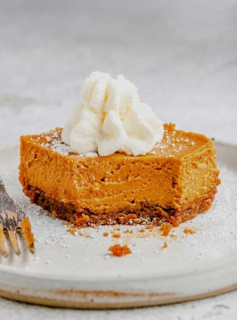 smooth easy pumpkin cheesecake with maple drizzle
