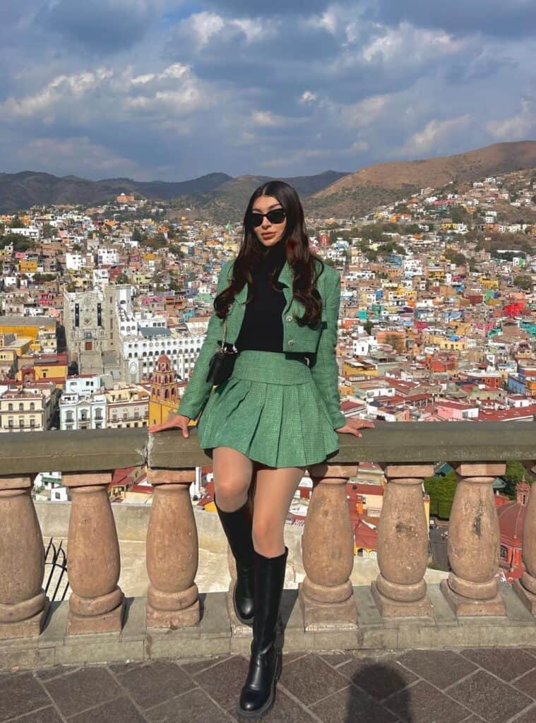 15 Green Tweed Cropped Jacket Pleated Mini Skirt and Black Knee Boots christmas green outfit tweed jacket pleated mini skirt