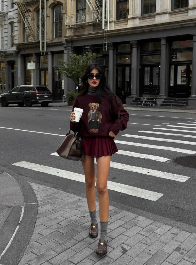 22 Bear Graphic Sweater Turtleneck Burgundy Pleated Mini Skirt Loafers red color outfits bear sweater turtleneck pleated skirt loafers