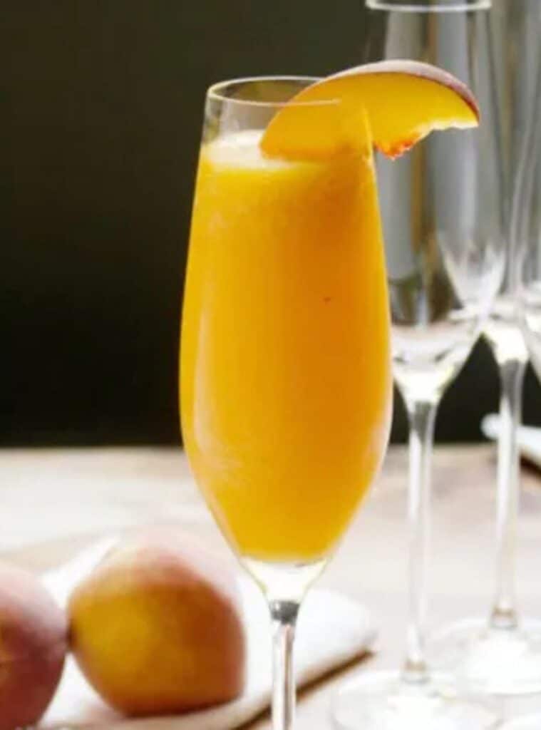 22 Peach Thyme Bellini Cocktail with Fresh Peach Puree peach thyme bellini holiday cocktail recipes