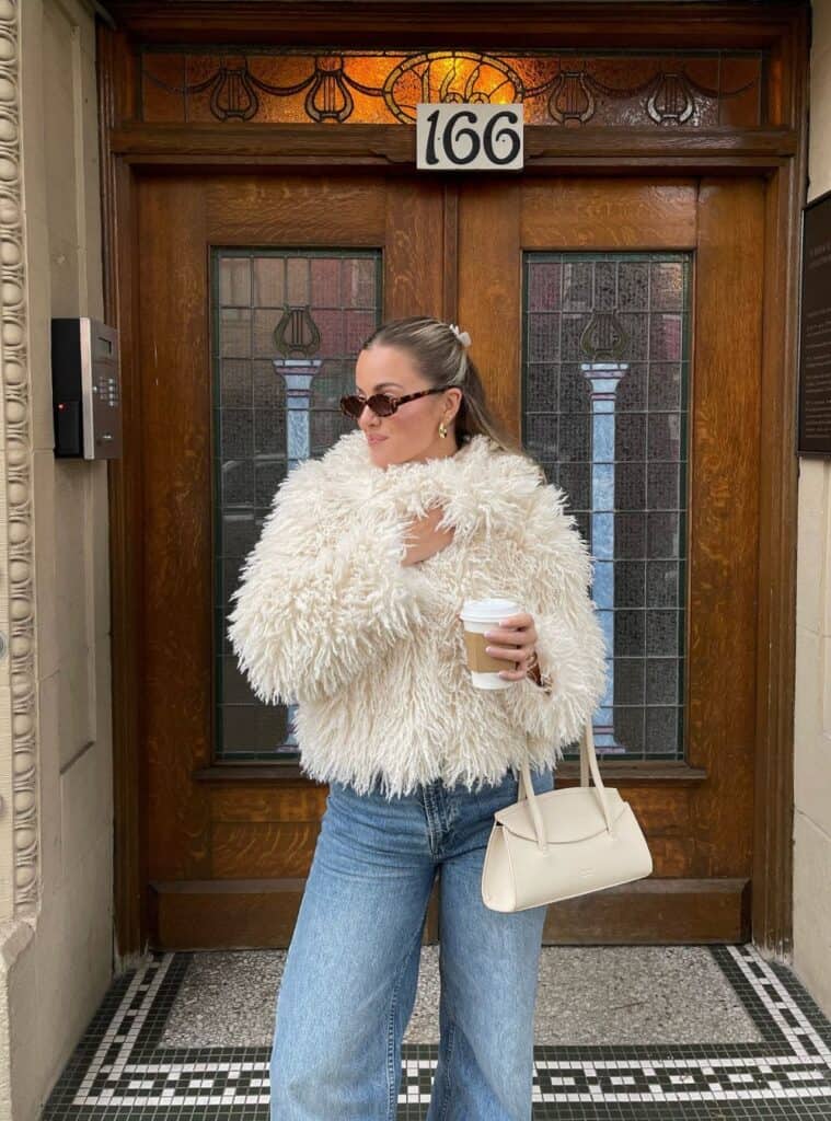 24 Shaggy Fur Jacket Light Wash Jeans and Structured Handbag white christmas outfit shaggy fur jacket light jeans