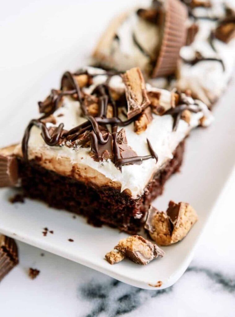 22 Reeses Peanut Butter Poke Cake Recipe peanut butter poke cake with chocolate drizzle, christmas potluck dessert