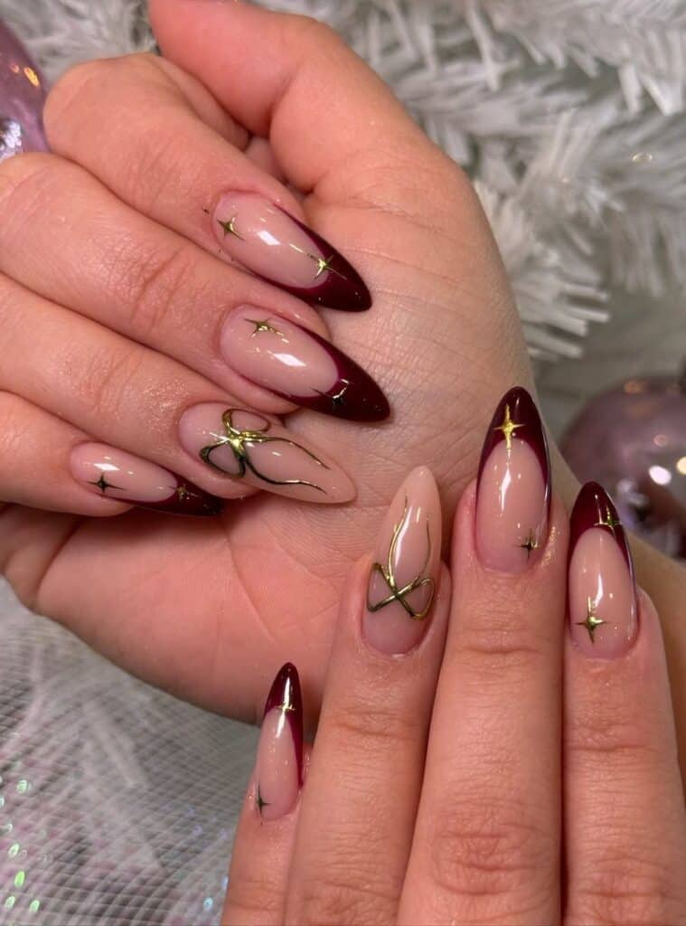 4 Burgundy Star Bow Stiletto Tips rich burgundy christmas nails with gold stars and bow charm