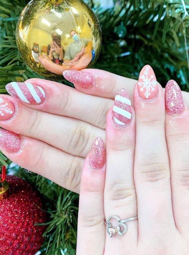 8 Pink Glitter Stiletto Snowflakes playful pink holiday glitter nails with shimmering snowflake details