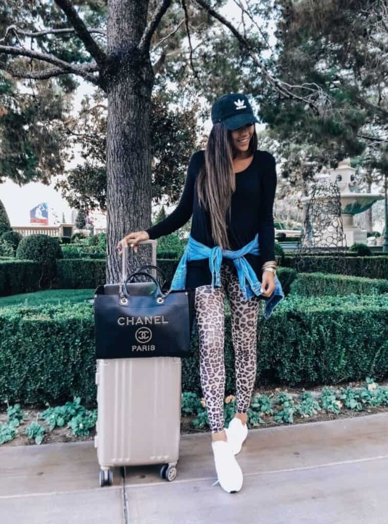 13 Black Long Sleeve Top Leopard Print Leggings White Sneakers black top with leopard leggings styled for casual vegas winter outfits