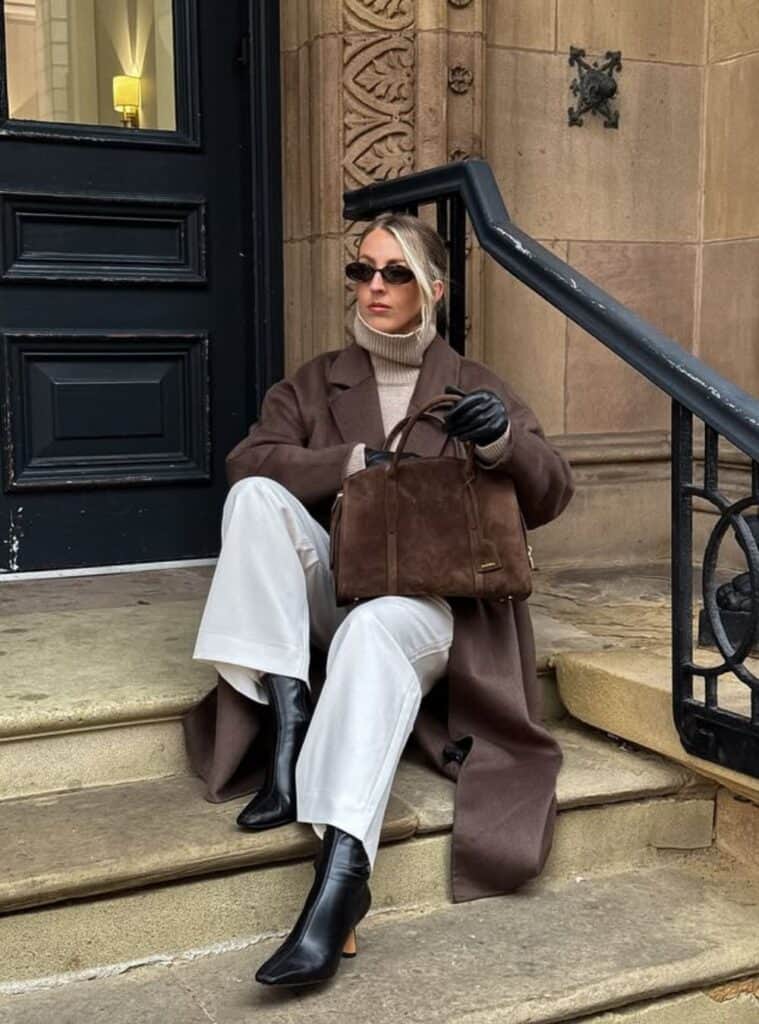14 Espresso Wool Coat Sand Turtleneck Ivory Wide Leg Pants neutral winter outfits for spain featuring an espresso wool coat layered over a sand turtleneck and ivory wide-leg pants