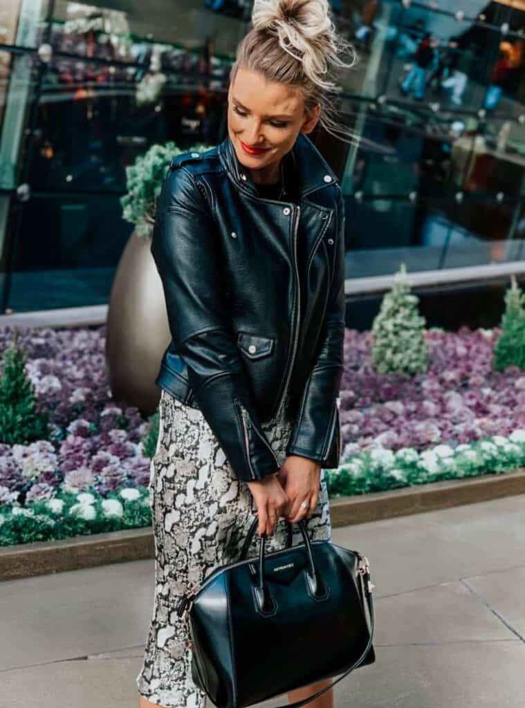 16 Black Leather Biker Jacket Snake Print Midi Skirt Black Leather Satchel leather jacket with snake print skirt styled for bold outfits for las vegas winter