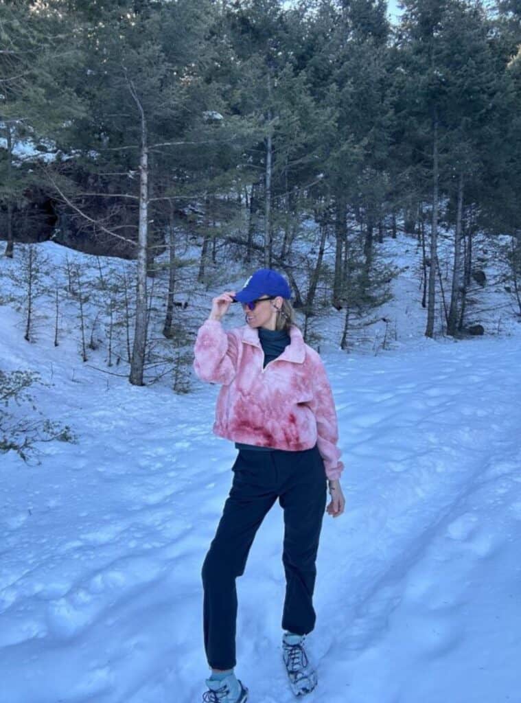 16 Pink Tie Dye Faux Fur Jacket Black Technical Trousers Royal Blue Baseball Cap 2 pink tie dye faux fur jacket styled with black technical trousers and a royal blue baseball cap a fun and playful winter hiking outfit