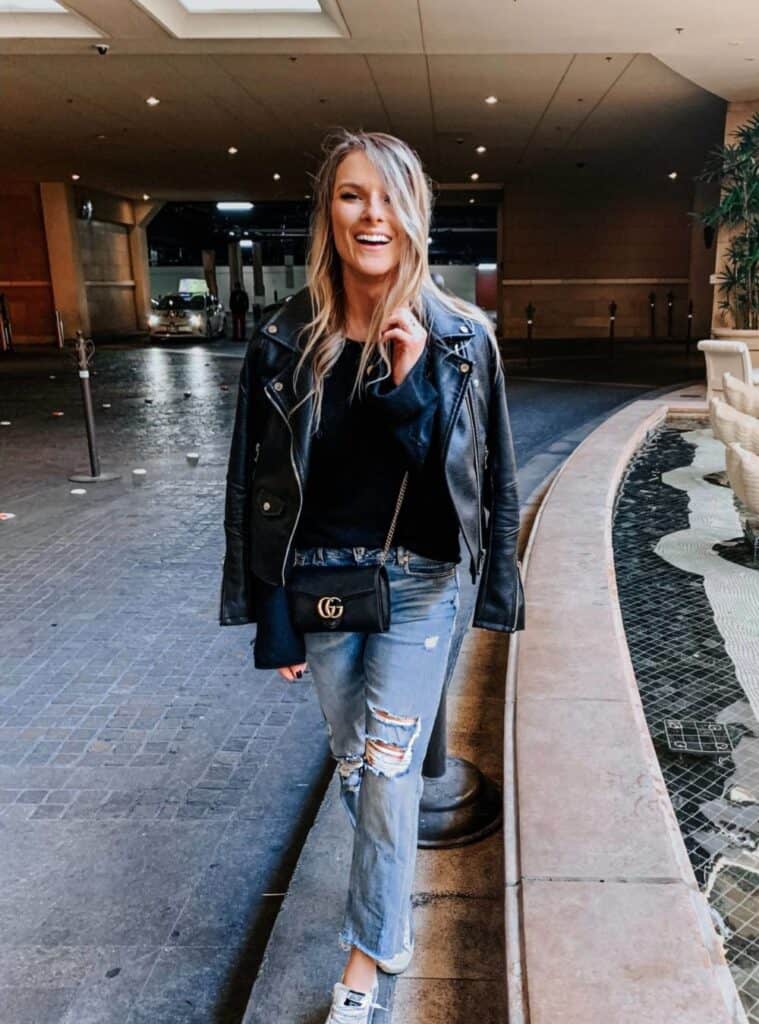 18 Black Leather Jacket Blue Distressed Jeans White Sneakers leather jacket and distressed jeans styled for everyday outfits for las vegas winter