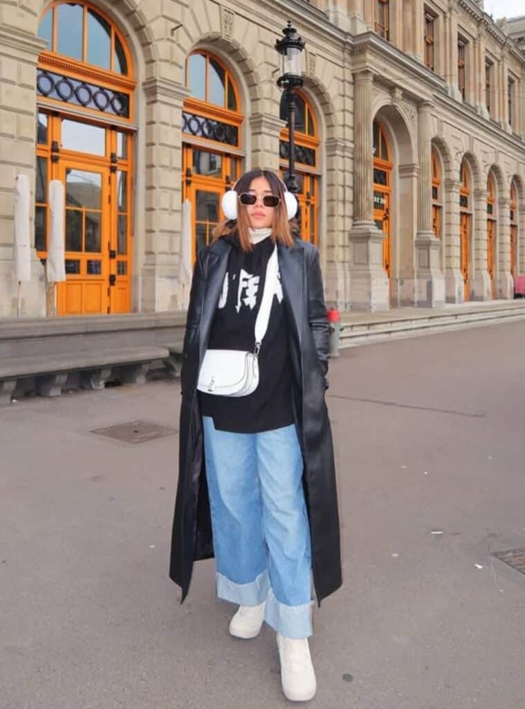 19 Long Black Leather Trench Graphic Hoodie Wide Leg Cuffed Jeans long black leather trench layered over a hoodie for edgy switzerland winter outfits