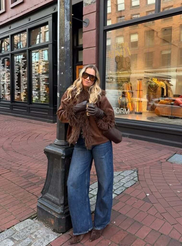 2 Chocolate Suede Fur Trimmed Jacket Dark Blue Wide Leg Jeans Pointed Boots chocolate suede fur trimmed jacket paired with wide leg jeans and pointed boots for switzerland winter outfits