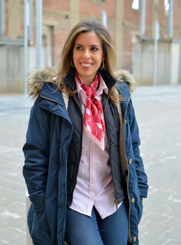2 Navy Fur Trim Parka Pink Button Down Shirt Dark Wash Jeans winter looks for spain featuring a navy fur-trim parka layered over a pink button-down shirt and dark wash jeans