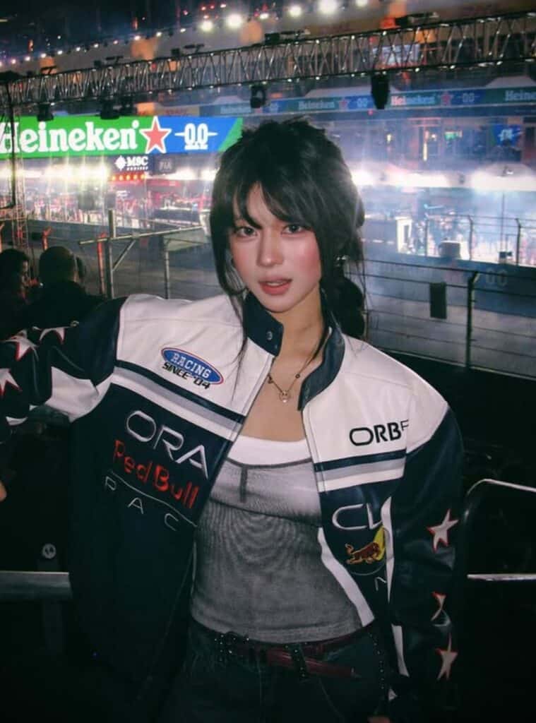 21 Black Racing Jacket Black Graphic Top Black Low top Sneakers 1 racing jacket and graphic top styled for sporty vegas winter outfits